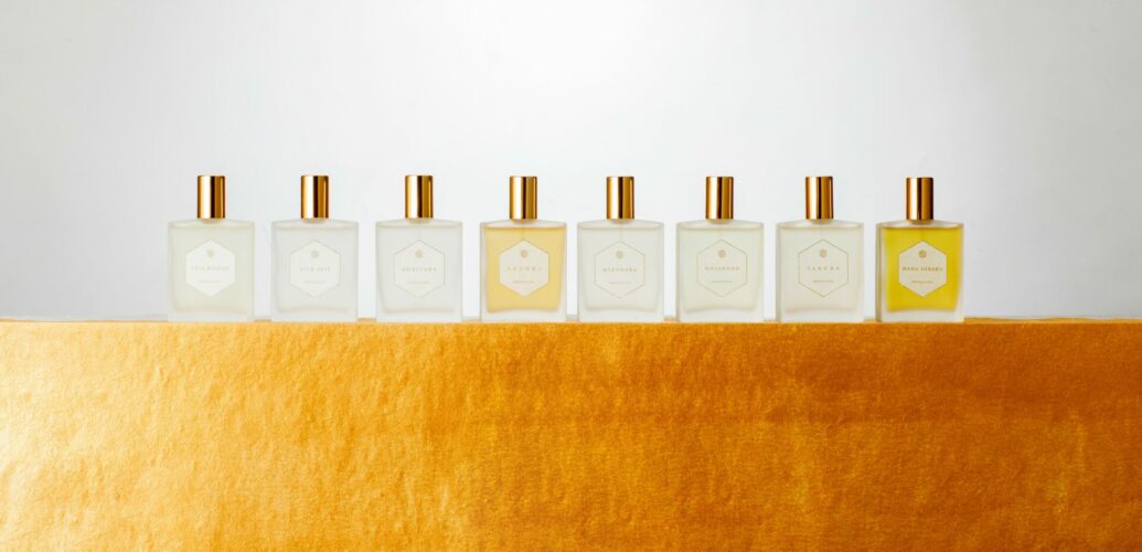 The PARFUM SATORI collection arranged on gold fabric, symbolising harmony, clarity and design.